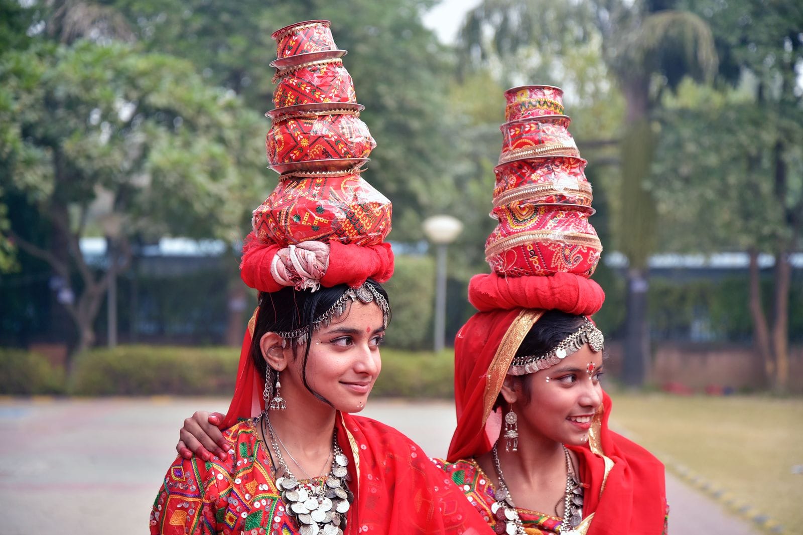 Indian folk dancers performing in colorful traditional attire, showcasing cultural heritage through expressive movements and vibrant costumes.
